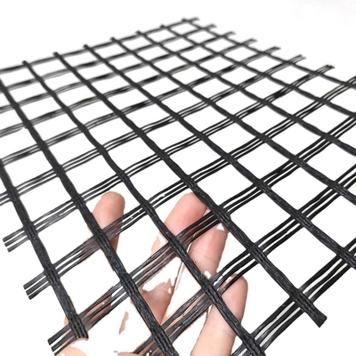 Сетка двухосного алкалиа ремонта дороги Bitume пряжи Geogrid стеклоткани устойчивая усиливая